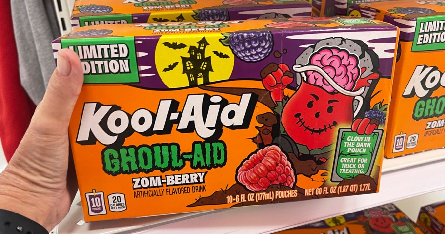 hand picking up a box of Kool-Aid Ghoul-Aid Zom-Berry Drinks from store shelf