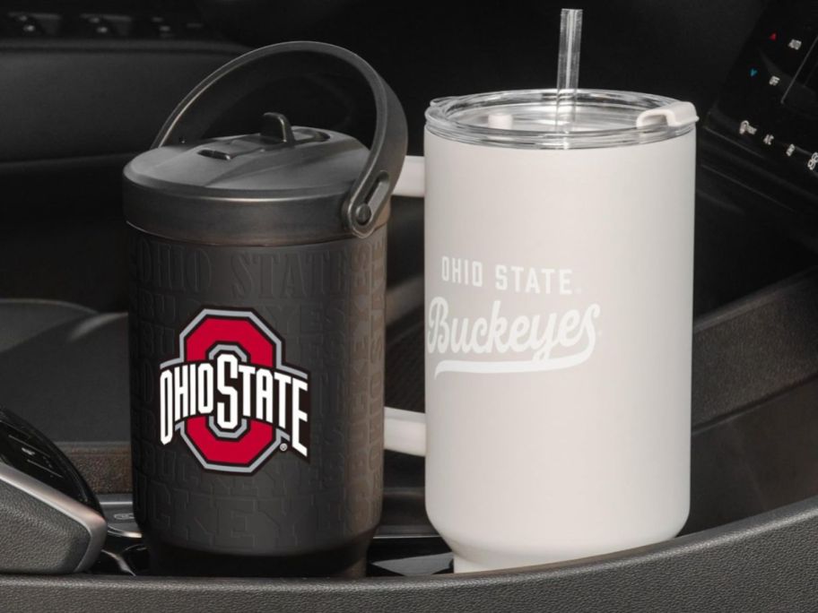 Two Ohio State Tumblers in a car console's cupholders
