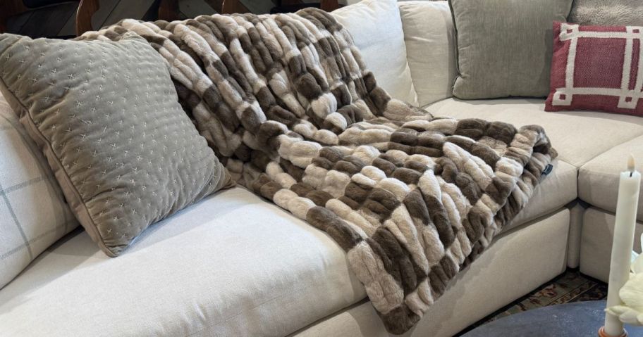 Couch with a Lola Blanket draped over the back