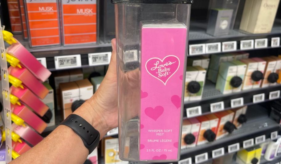 Hand holding Love bay soft perfume at the store