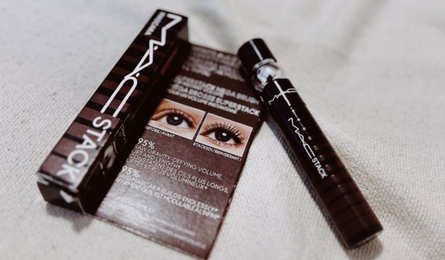 MAC Stacks mascara on top of a bed