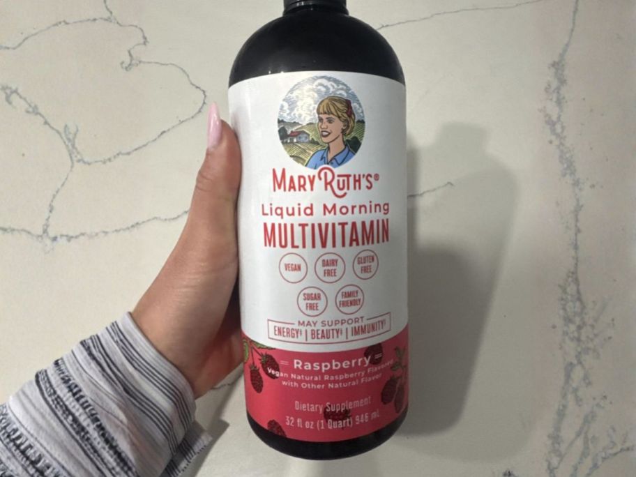 hand holding MaryRuth's Liquid Morning Multivitamin 32oz bottle