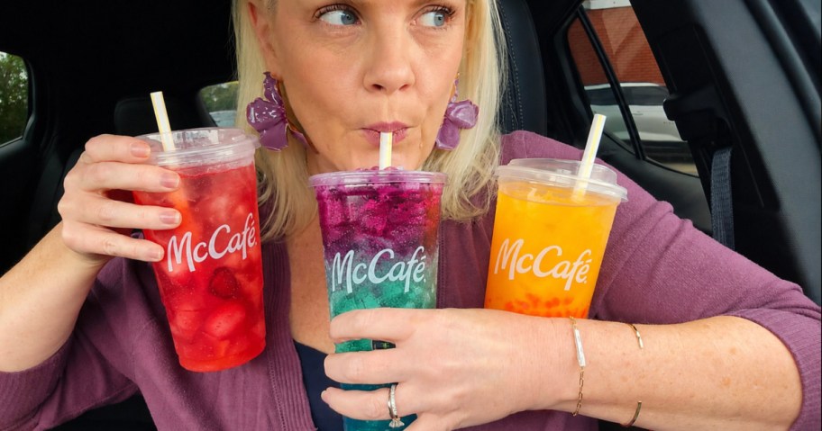 Women holding McDonald's drinks, and drinking the new energy drink