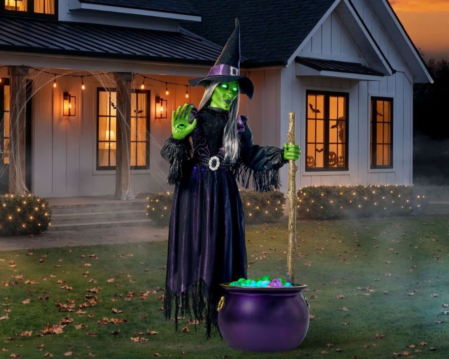 floating witch decoration in front yard