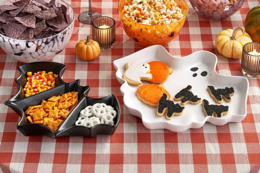 ghost and bat trays filled with food on picnic table