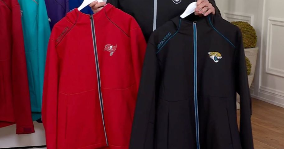 Two NFL Softshell Jackets with hood on Hangers