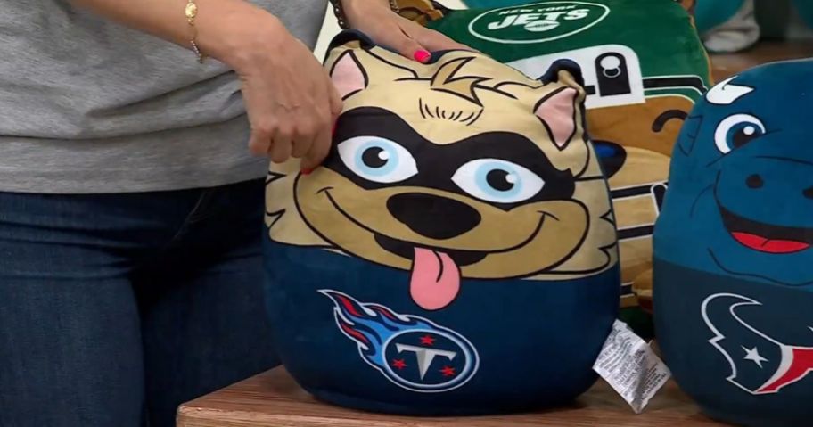 woman holding NFL Officially Licensed Titans Mascot Plushie by Pegasus Sports