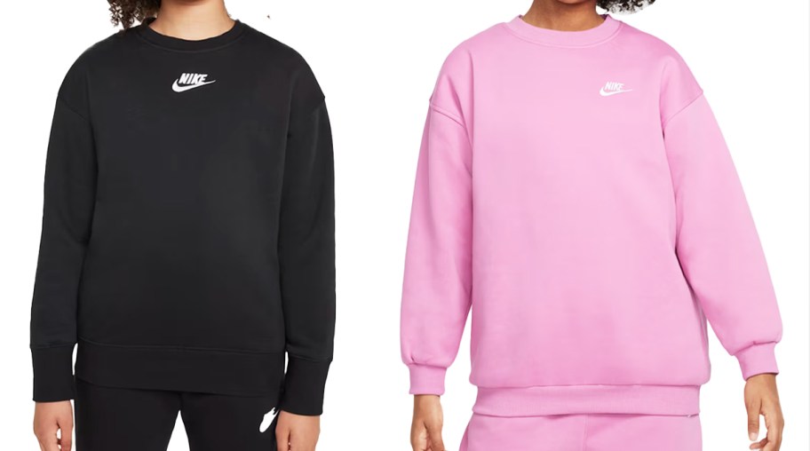 two kids in black and pink nike sweatshirts