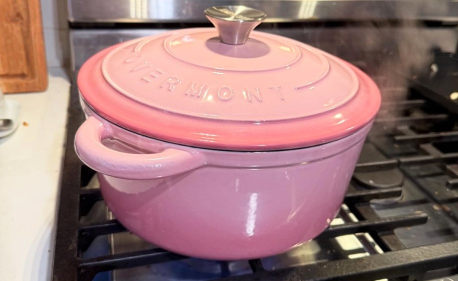 pink cast iron dutch oven on a stove