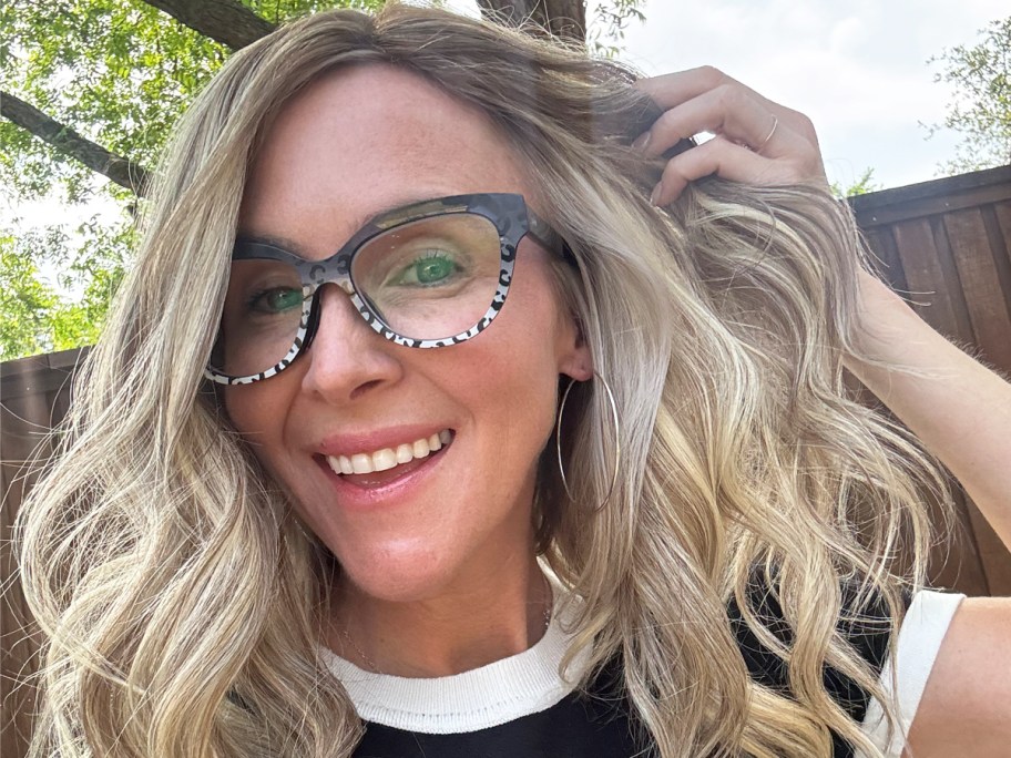 woman with blonde hair wearing leopard print glasses