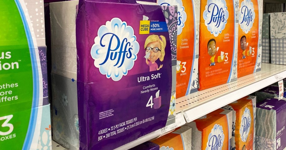 purple box of Puffs Ultra Soft Tissues on store shelf