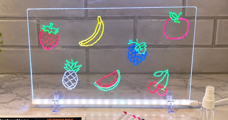 fruits drawn on an led drawing board