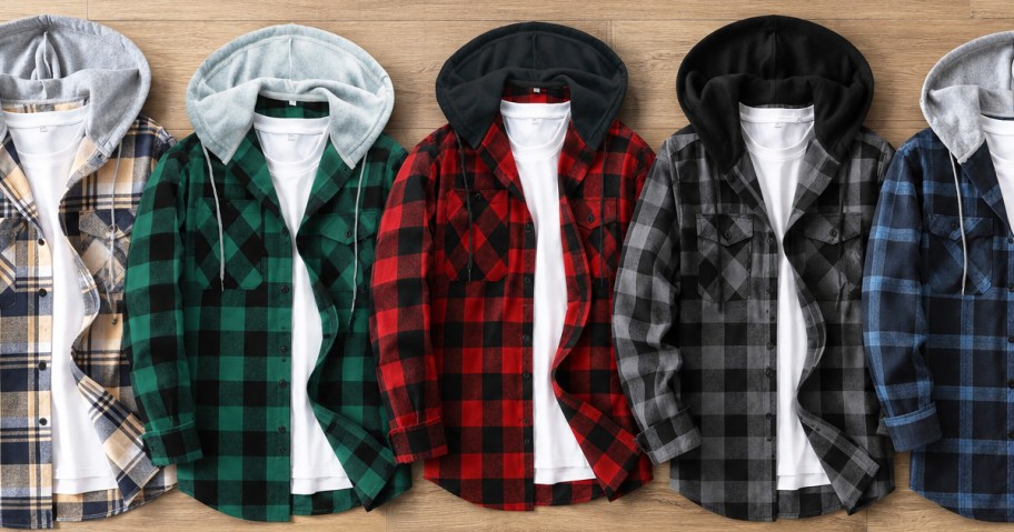 colorful flannel hoodies in a row on wood floor