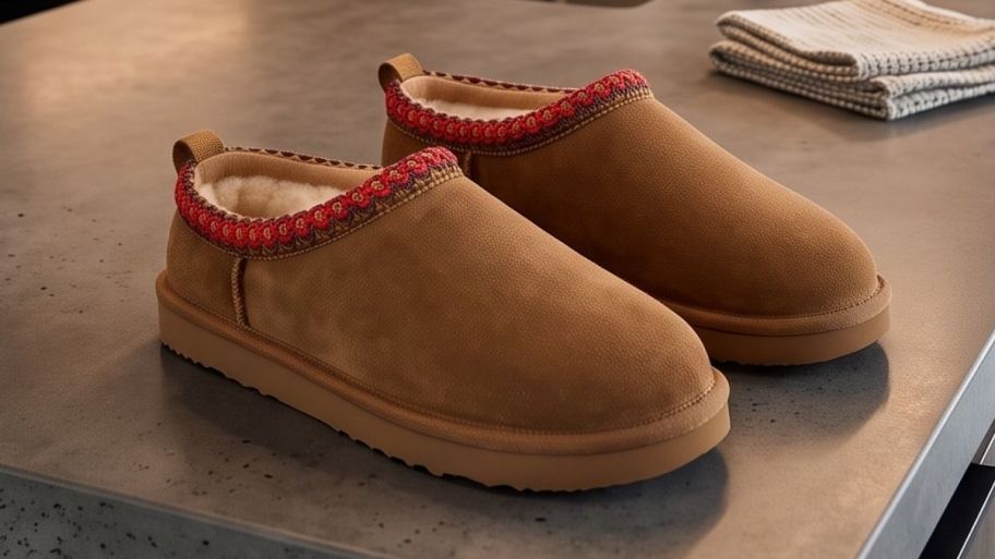 Sams club ugg lookalike slippers on top of a kitchen island