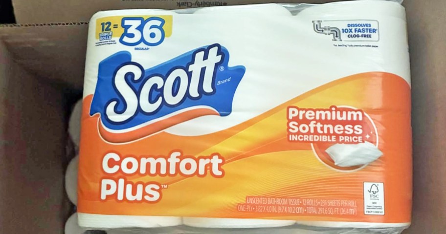 cardboard box full of packs of Scott ComfortPlus Toilet Paper