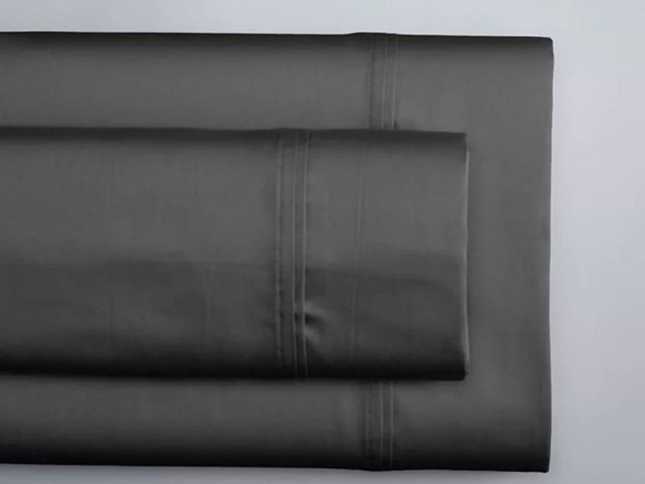 grey Simply Vera Vera Wang Signature Tencel Sheet Set folded on table