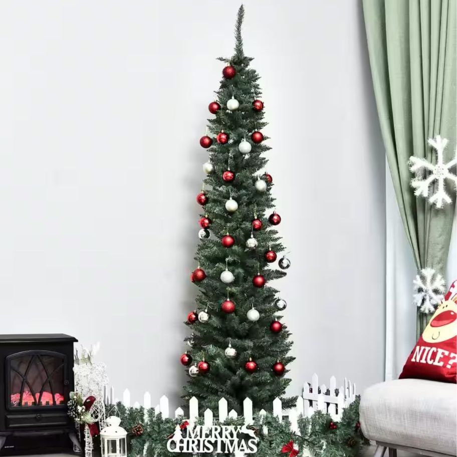 Skinny Home Depot Christmas tree displayed in the living room