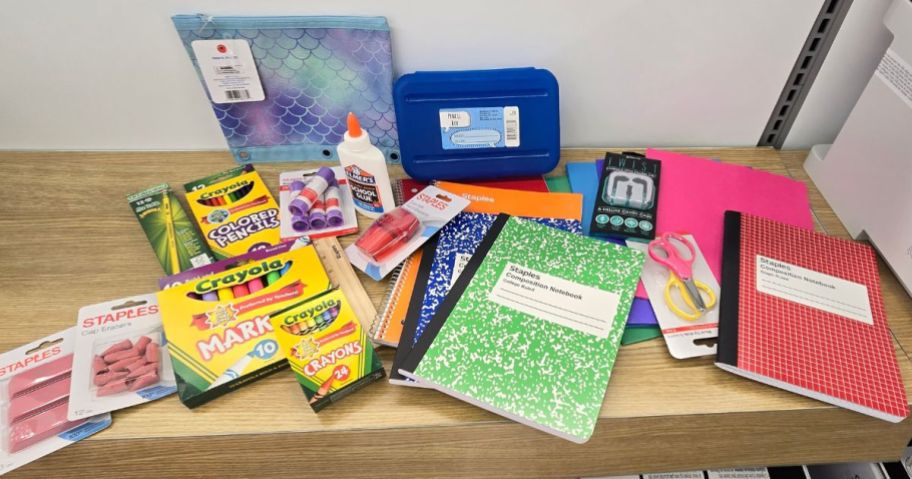 A table filled with Staples School Supplies