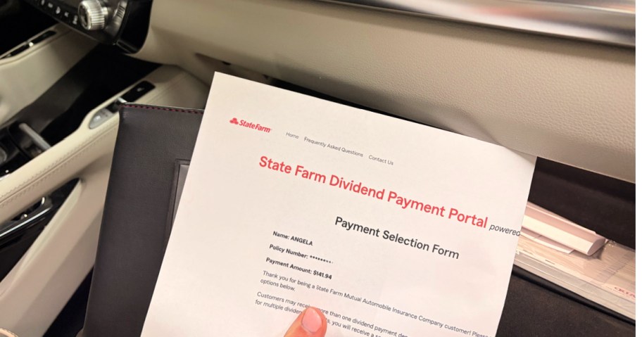 State Farm dividend payment form inside car by glove compartment
