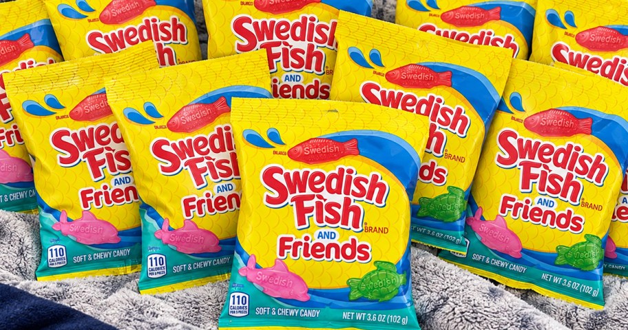 multiple small yellow bags of Swedish Fish & Friends candies