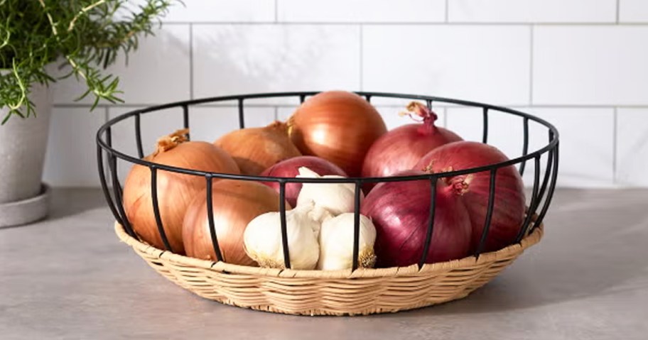 onions and garlic inside a countertop bowl