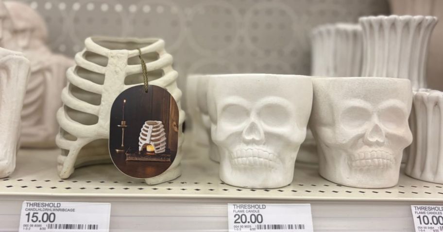 Threshold Halloween candles and holders on shelf in store