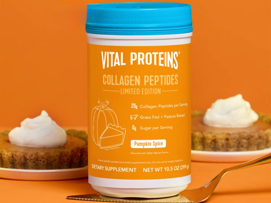 container of Vital Proteins Pumpkin Spice Collagen Peptides on a pie server with pie in background