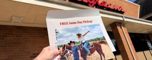 Hand holding 8 x 10 photo print outside of Walgreens store