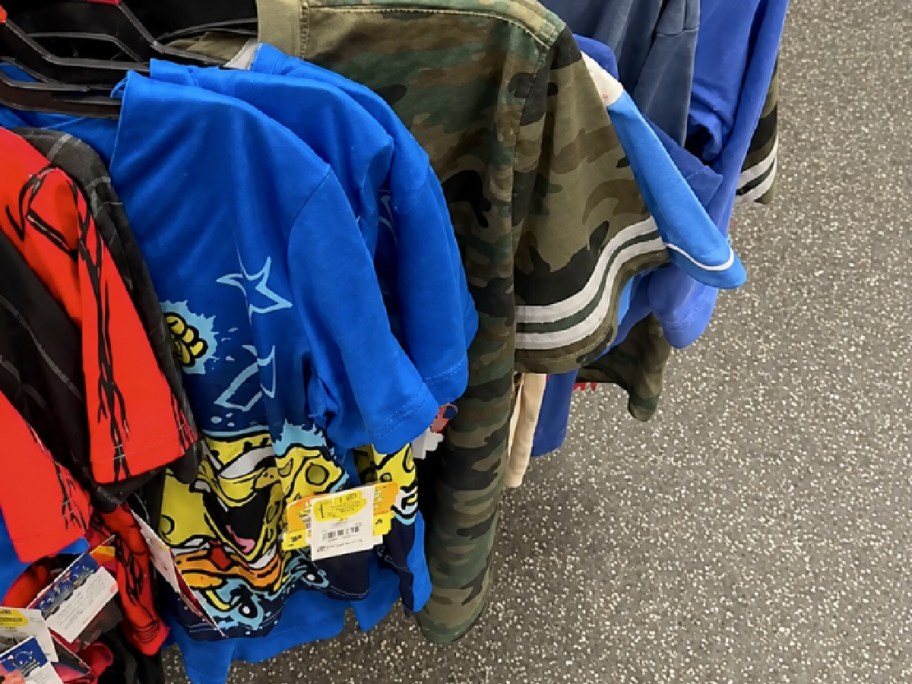 Walmart kids clearance clothing hanging off of shopping cart