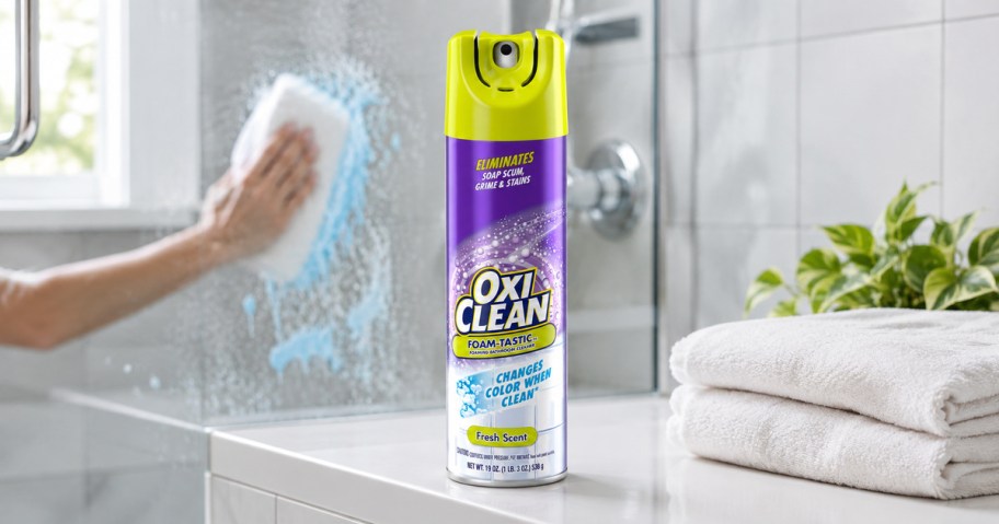 OxiClean Foam-Tastic bathroom cleaner beside a glass shower being cleaned
