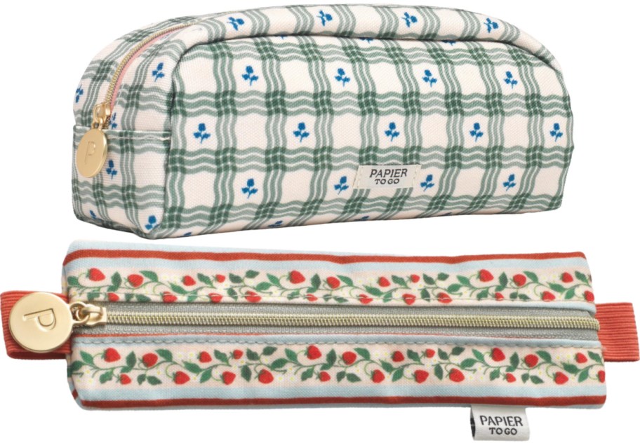 Two Papier to Go pencil pouches featuring a green plaid and blue floral pattern on top, and a strawberry vine pattern with red accents on the bottom.