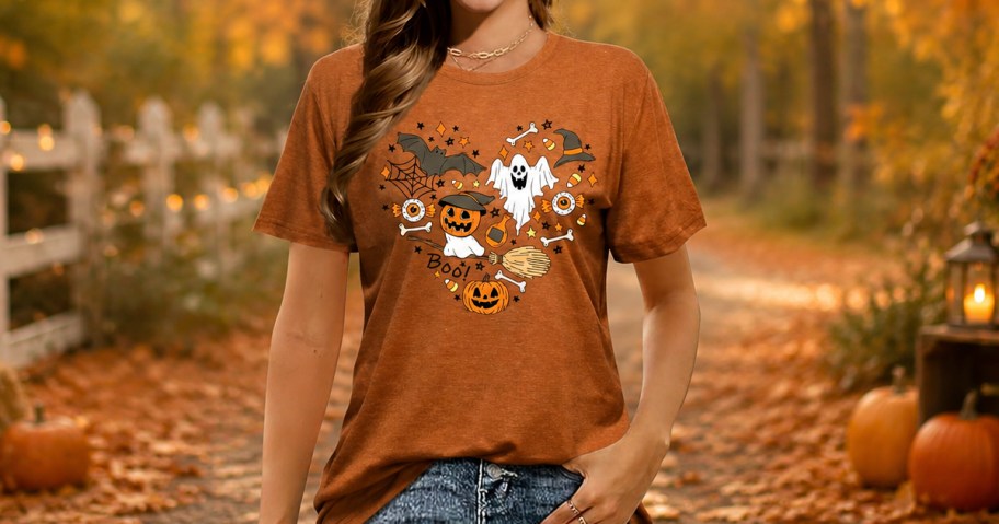 woman wearing a t-shirt with halloween graphics in the shape of a heart