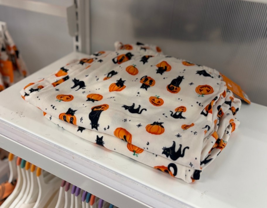 white cat and pumpkin print pajamas