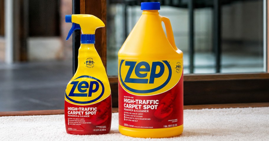 spray bottle and gallon bottle of ZEP High-Traffic Carpet Cleaner sitting on carpet