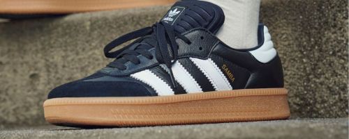 person wearing adidas Samba XLG Shoes on steps