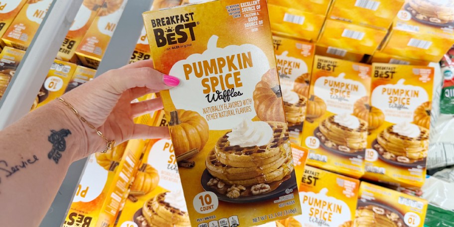 hand holding box of pumpkin spice waffles 