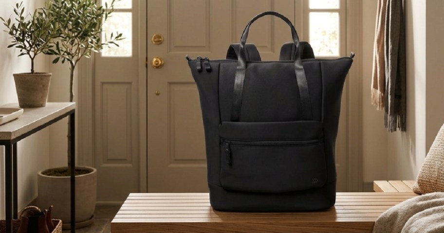 black tote bag in an entryway