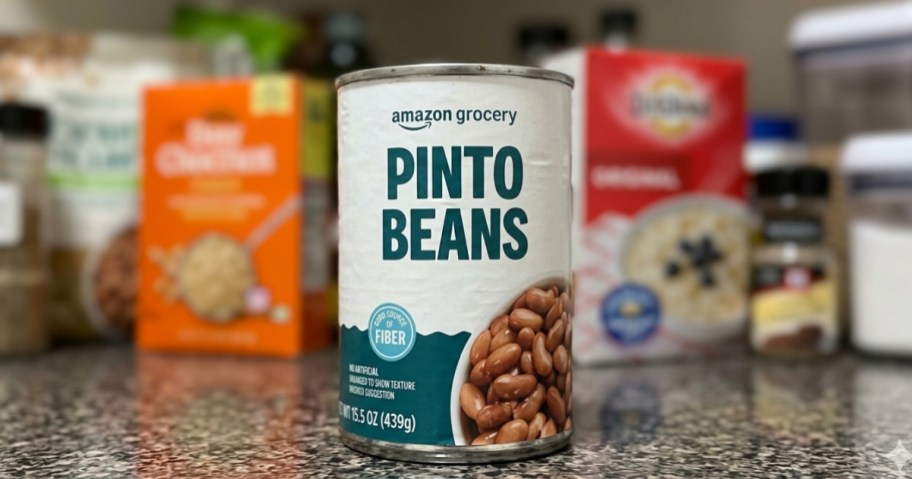 can of pinto beans on kitchen counter with other groceries