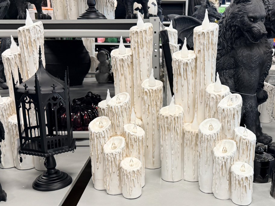 white clusters of candles and black lantern 