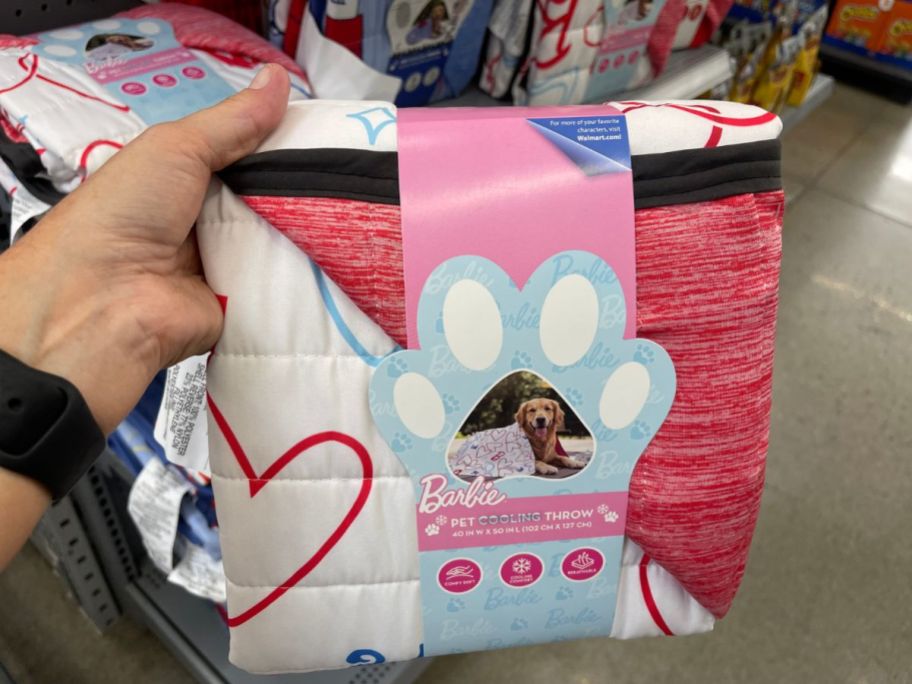 hand holding barbie Pet Cooling Throw Blanket in store