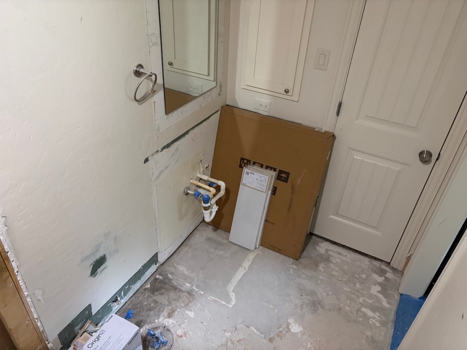 demoed bathroom with empty space