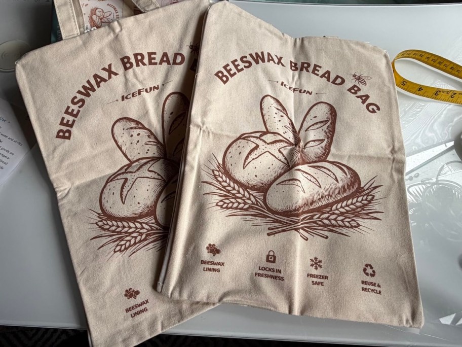 Two sourdough beeswax bread bags laying on counter 