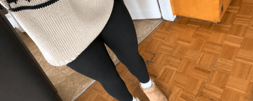 woman wearing black leggings and tan slippers