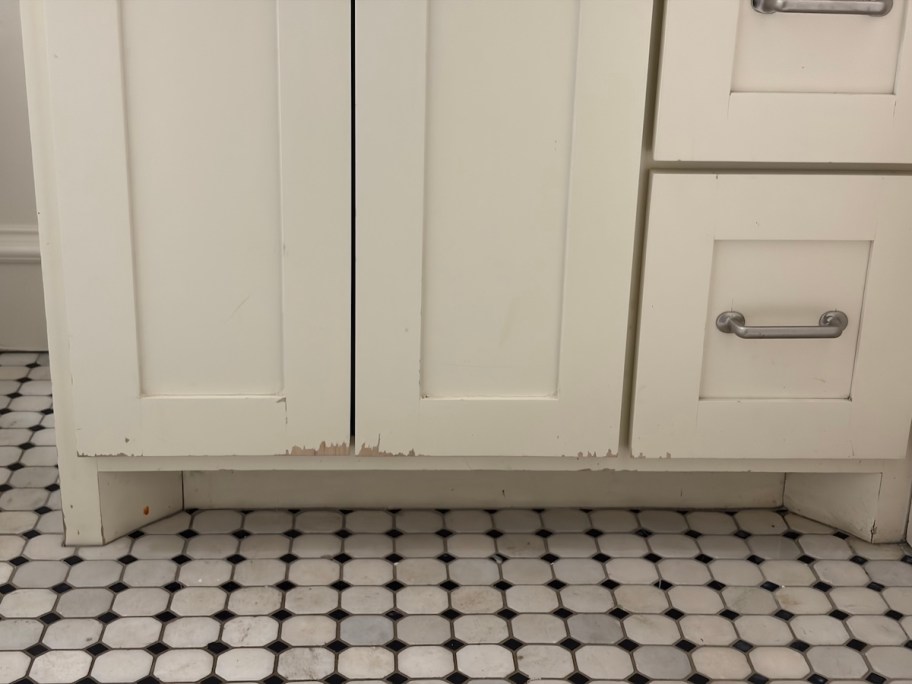 close up of chipped paint on bathroom vanity