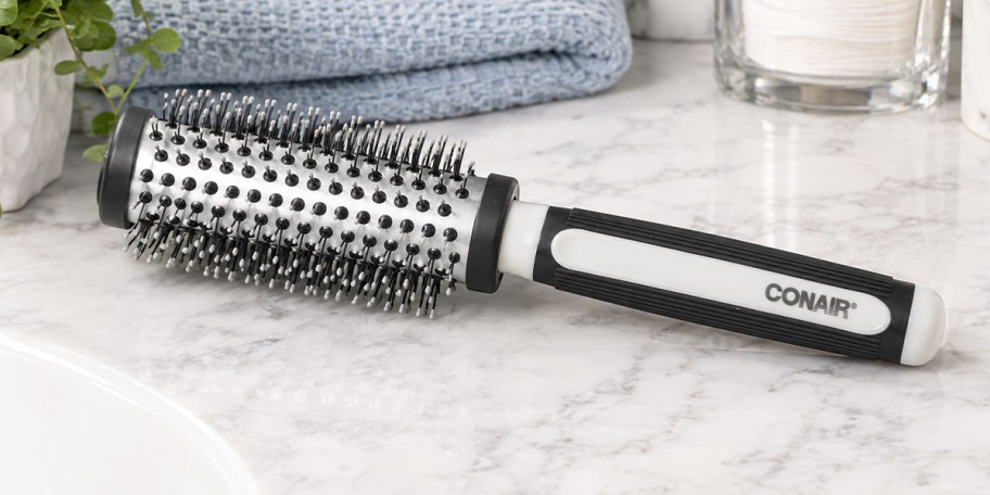 black and silver round brush on counter 