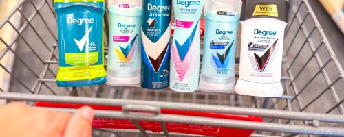 deodorant sticks and sprays inside red shopping cart