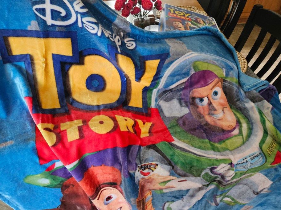 toy story blanket spread across a table