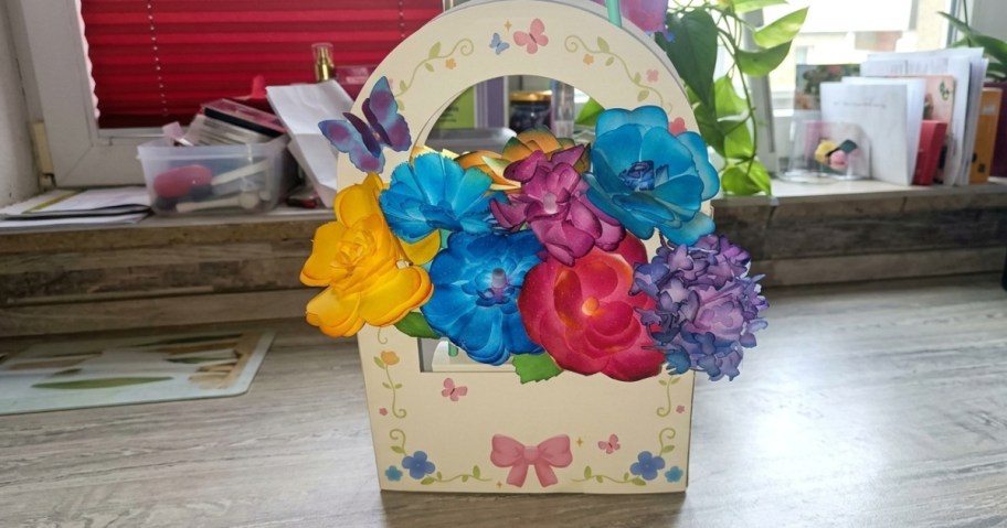 basket of paper flowers on a counter