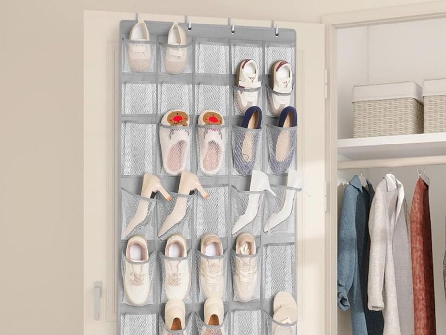 door hanging organizer with shoes inside of each slot hanging from the door 