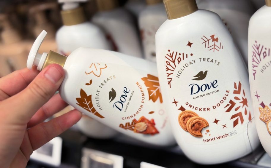 hand tipping a bottle of hand soap off a store shelf